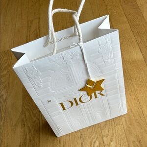 Dior empty shopping bag, gold star accessory. From glasses purchased in Paris.